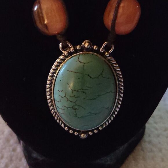 Faux turquoise, wooden bead with silver-toned accents. 10 inch-11 1/2 inch drop. - Picture 1 of 4